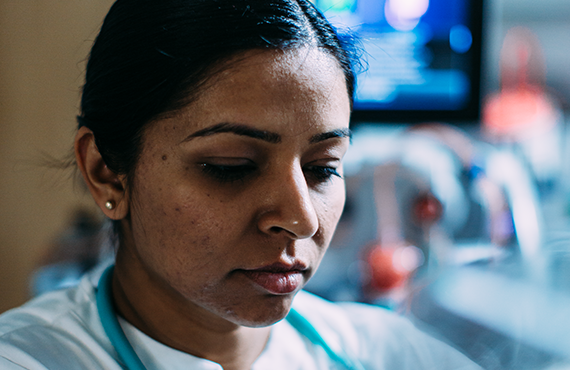 Woman with acute equipment in background